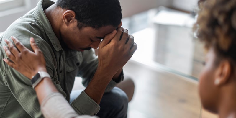 depressed man sitting 