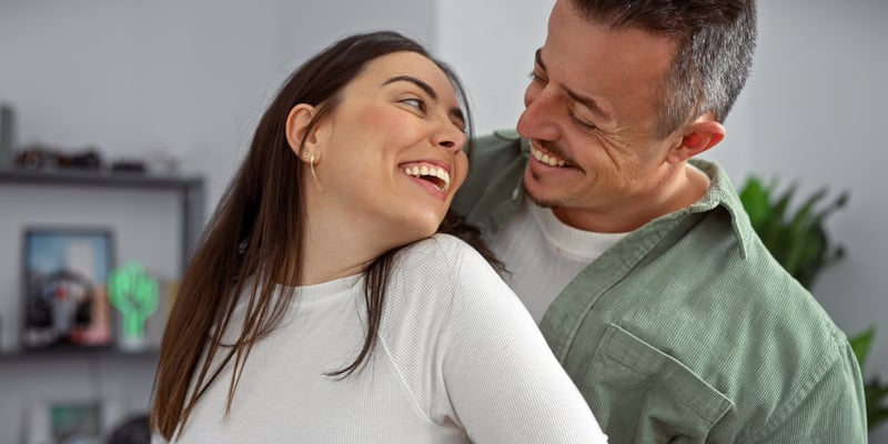 A male and female partner looking intimately with each other